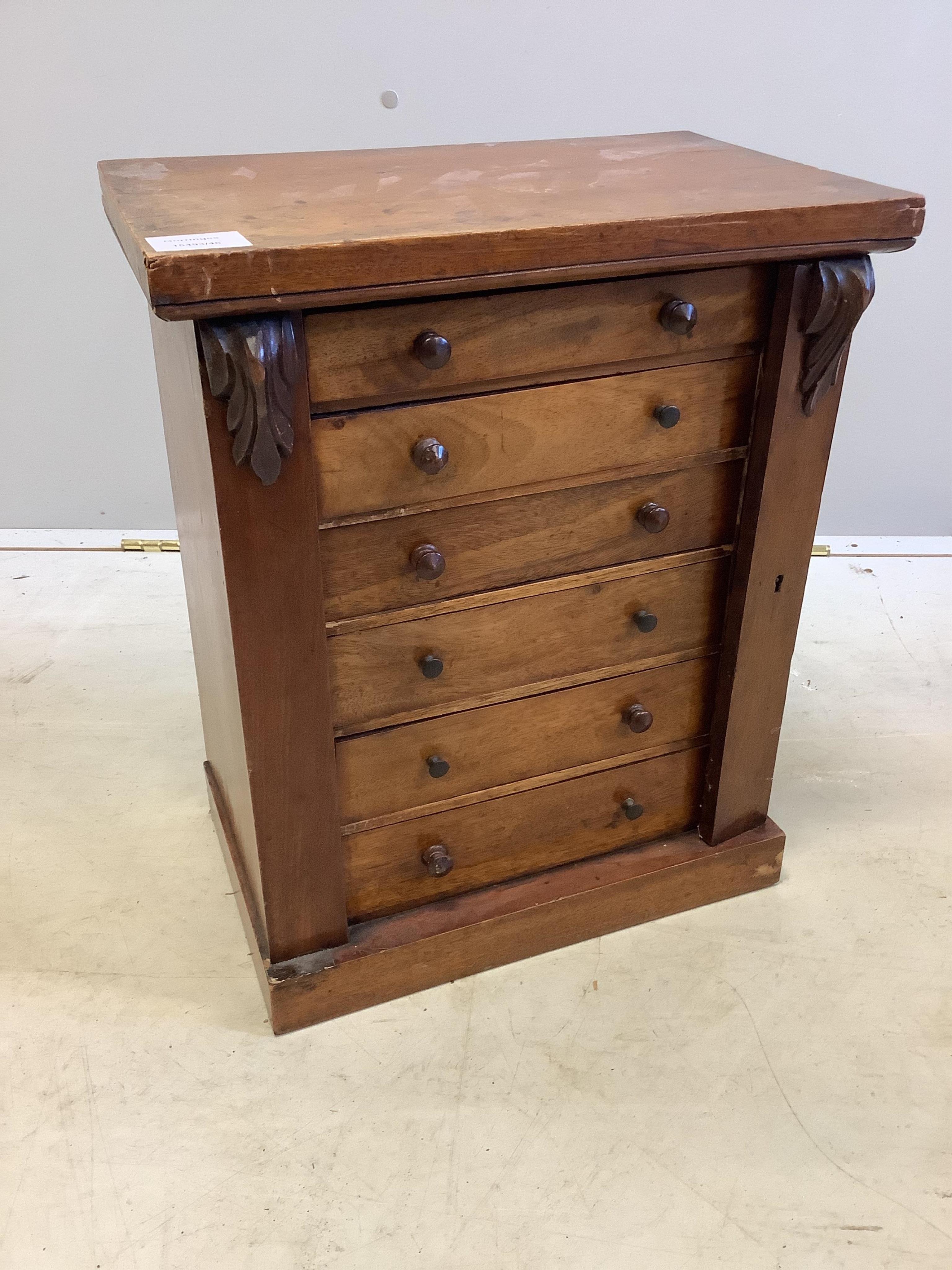 A late Victorian mahogany miniature Wellington chest, width 38cm, depth 25cm, height 46cm. Condition - poor to fair